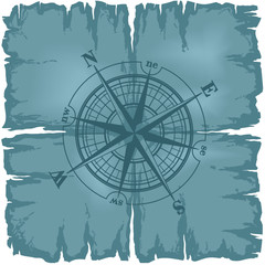Old damaged sheet of paper with compass rose.