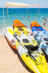 Water kayaks and pedal boats on the sea and on the beach