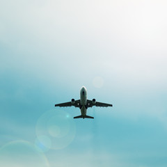 Silhouette of passenger airplane flying in the sky