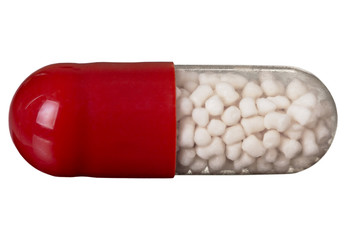 One red pill isolated on white