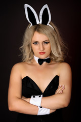 Sullen girl in sexy bunny costume
