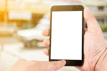 Man hand hold blank touch screen smart phone on abstract blurred