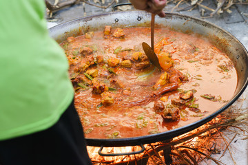 Cooking of a raditional spanish dish paella
