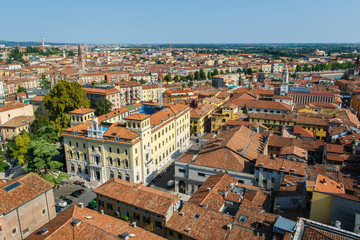 Fototapeta premium Panoramic view of Verona city in Italy. View of the red roofs in romantic city. Verona is a popular tourist destination of Europe. 