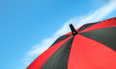 red umbrella and blue sky