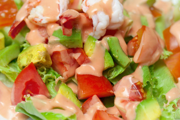 Shrimp salad with avocado close up