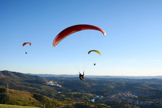 Paragliding flying over mountains