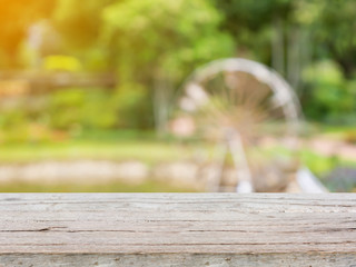 empty wood table with blurred garden park natural background