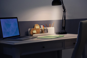 Stylish workplace with laptop at home