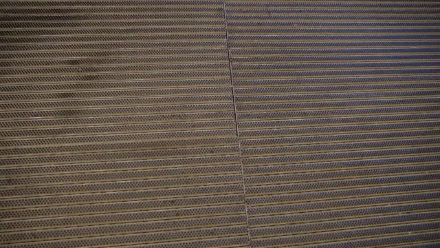 The floormat of the floor in a building it is brown in color that is clean