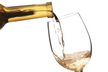 White wine pouring in glass, isolated on white