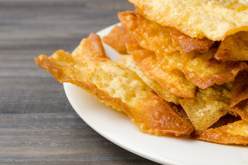 Close up of fried dumplings. Chinese food on wooden background.
