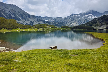 Clouds over Banderishki chukar peak and mountain river, Pirin Mountain, Bulgaria