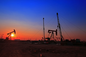 Sunset time of oil pump, oil industry equipment
