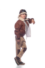 the boy is an aviator in the jacket of the pilot and in old glasses