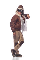 the boy is an aviator in the jacket of the pilot and in old glasses