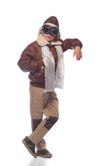the boy is an aviator in the jacket of the pilot and in old glasses