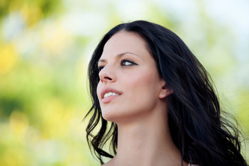 Fototapeta premium Beautiful brunette girl relaxing in the park