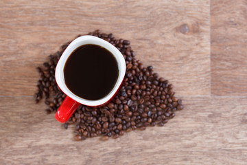 Woman holding a cup of hot coffee