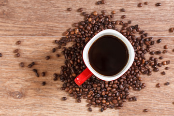 Woman holding a cup of hot coffee