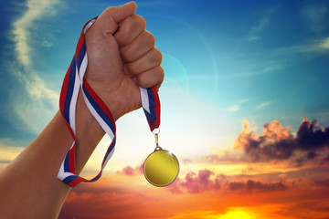 The sportsman holding a gold medal