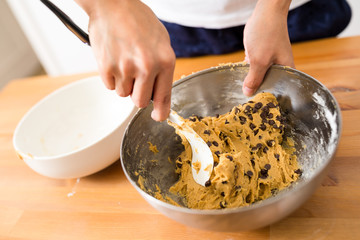 Woman making chocolate cookies