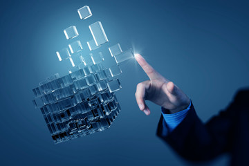 Cube in male hand . Mixed media