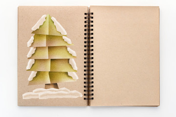 x'mas tree paper cut style on blank page sketchbook