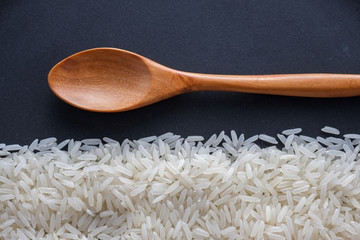 Jasmine rice and wooden spoon