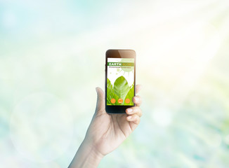 Woman holding smartphone showing screen environmental web blog 