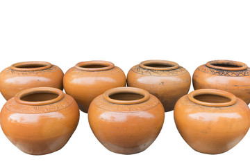 Isolated handmade earthenware are arranged on the white backgrou