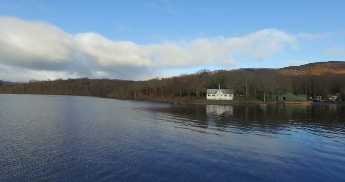 Aerial: Loch Tay in the Scottish Highlands during a beautiful clear winters day, Scotland