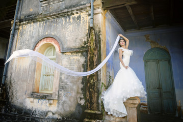 Asian girl in a white dress. wedding dress