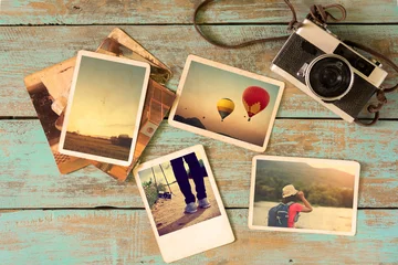 Fotobehang Photo album remembrance and nostalgia in summer journey trip on wood table. instant photo of vintage camera - vintage and retro style © jakkapan