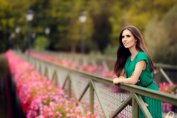 Happy Melancholic Woman on a Bridge with Flowers