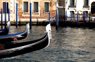 Fototapeta na wymiar Venetian gondolas sailing the waters of the Grand Canal
