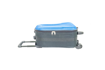 Closeup blue luggage isolated on white background , fabric luggage with plastic roller for travel with clipping path