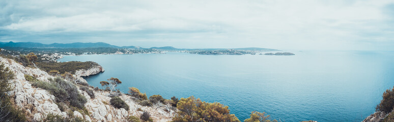 Panoramic view from rocky cliff toward ocean