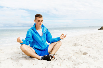 Man training on beach outside