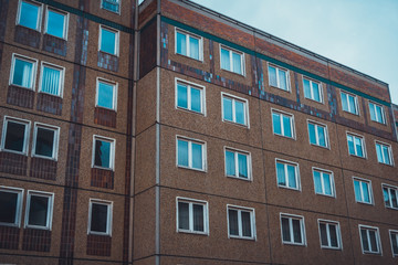 Fototapeta na wymiar Modern apartments with sky reflecting in window