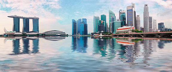 Singapore skyline with skyscrapers and reflection in water