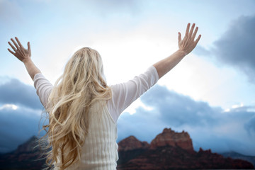 Woman with raised hands.
