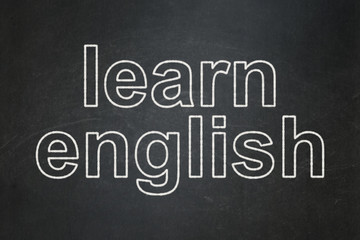 Obraz premium Education concept: Learn English on chalkboard background