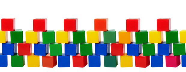 Old plastic color blocks - toys isolated on white background