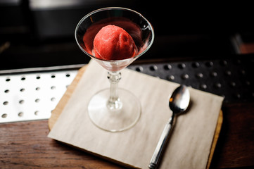 cocktail glass of strawberry dessert with sorbet,