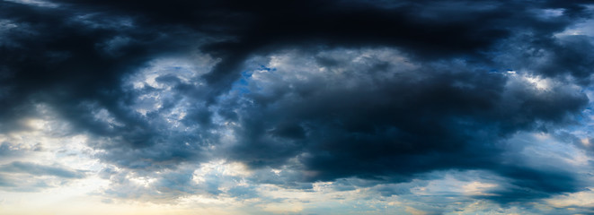 Naklejka na ściany i meble Stormy dark blue cloudy sky. High resolution panorama.