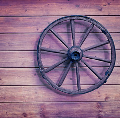 Vintage wooden wheel on wall
