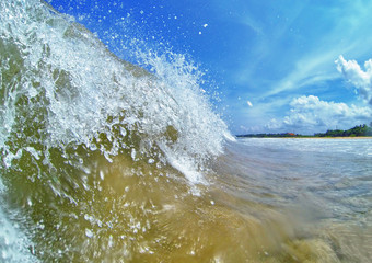 Big wave on a tropical beach