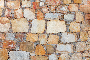 Background - a wall made of natural stone