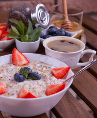 Healthy Homemade Oatmeal with Berries for Breakfast. Fitness food.